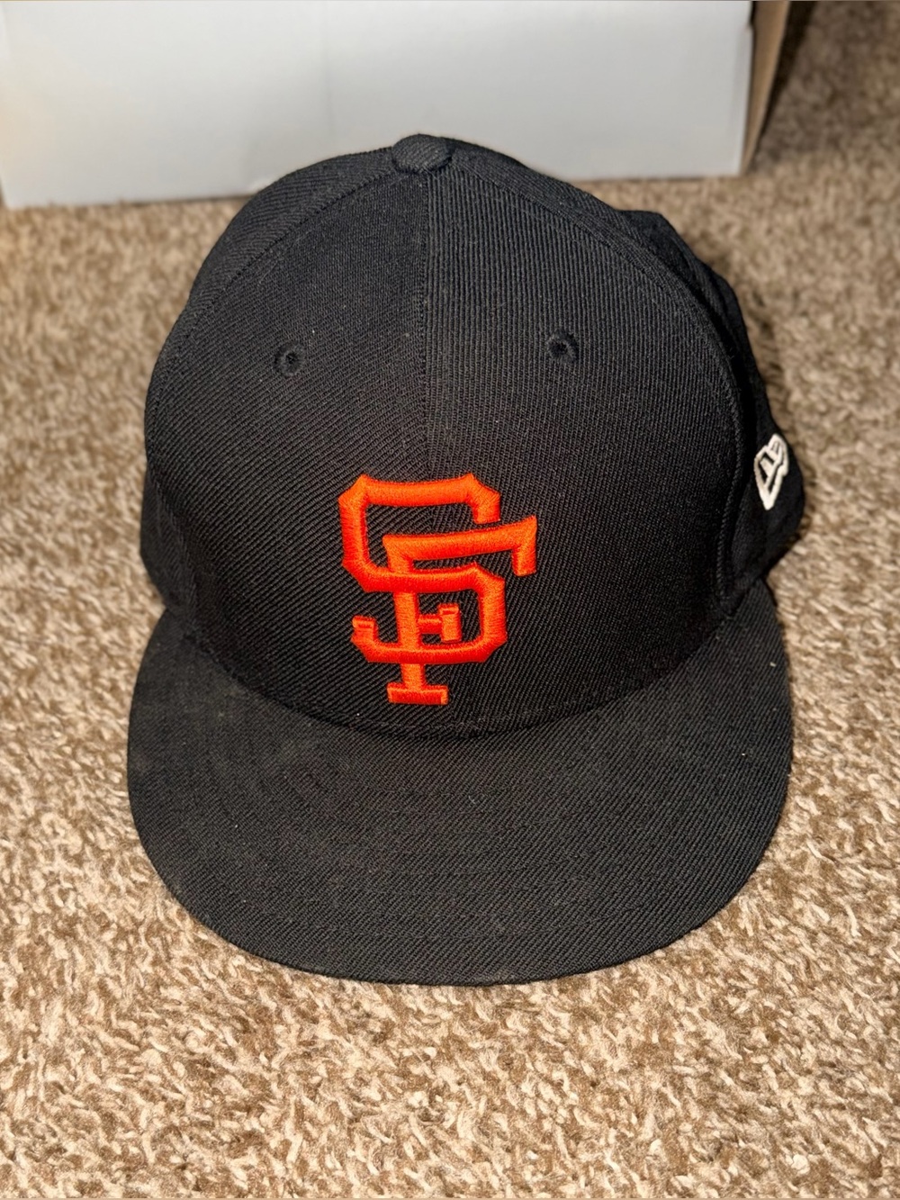 New Era 59FIFTY fitted cap featuring an orange San Francisco Giants "SF" 7.5